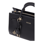 Lieblingstasche ECS Tote M in black faux leather with a braided handle and gold-tone logo charm detail.