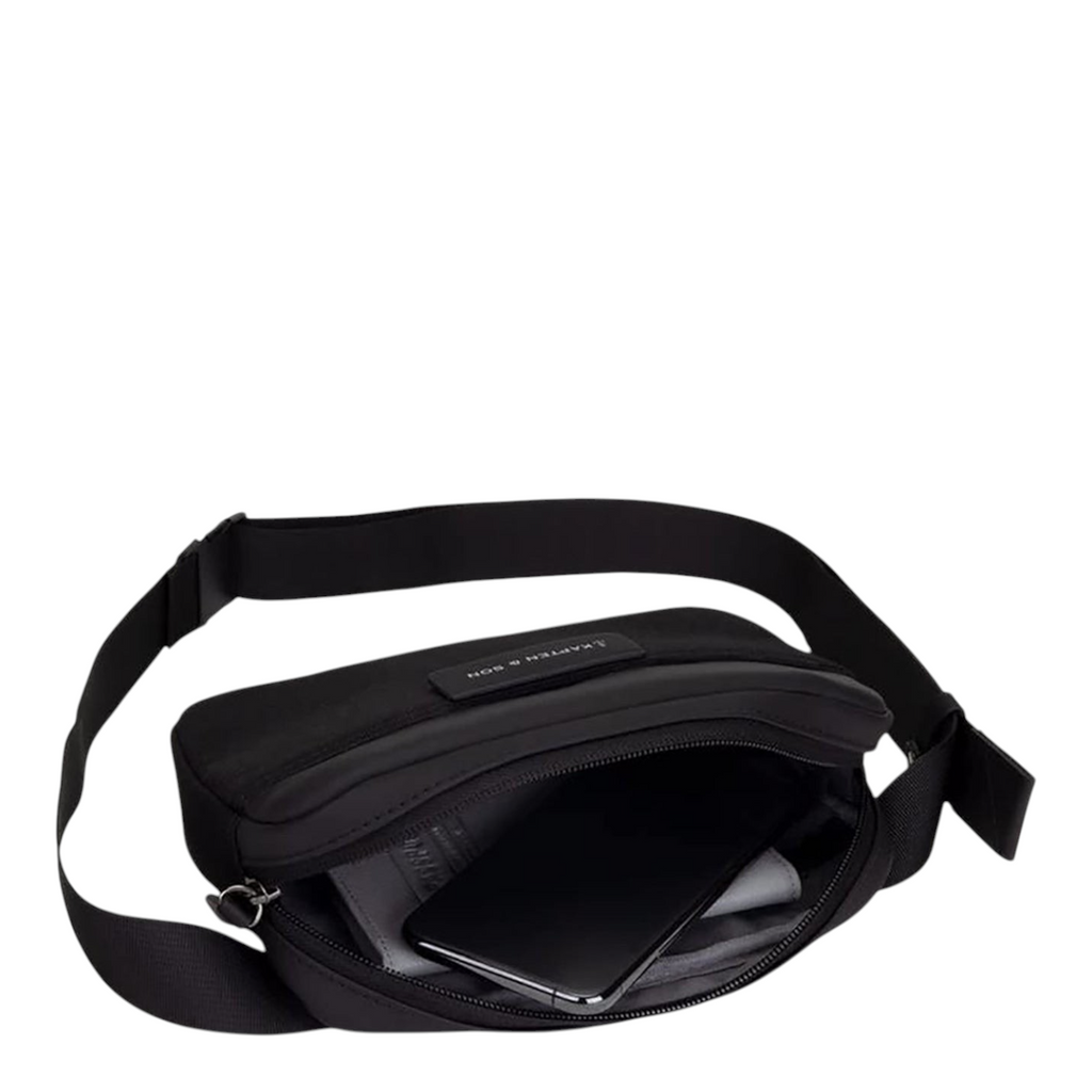 Lieblingstasche Habo black crossbody bag with open zipper showing internal storage for smartphone and essentials
