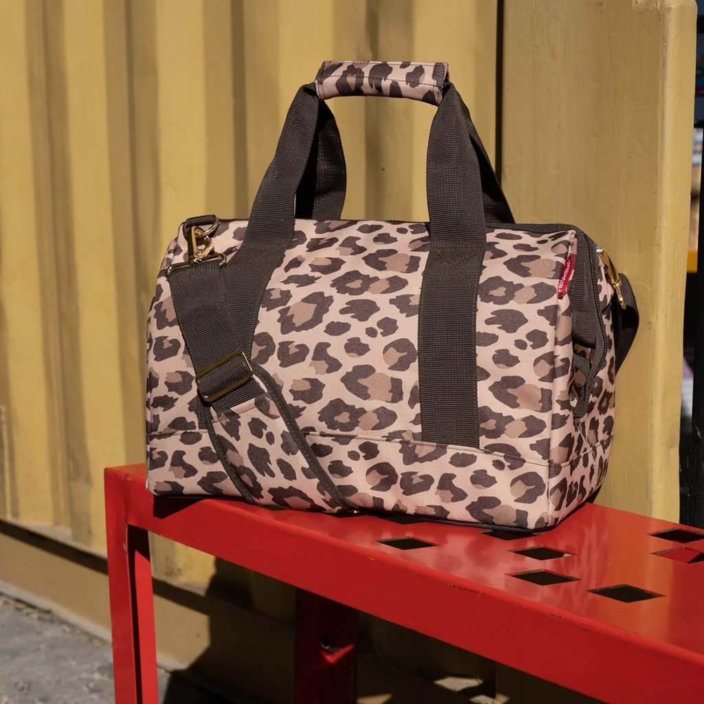 Lieblingstasche Allrounder M travel bag in a brown leopard print pattern with sturdy handles and shoulder strap