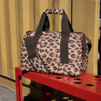 Lieblingstasche Allrounder M travel bag in a brown leopard print pattern with sturdy handles and shoulder strap