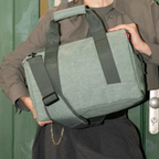 Lieblingstasche Allrounder M travel bag in sage green polyester with sturdy handles and adjustable shoulder strap