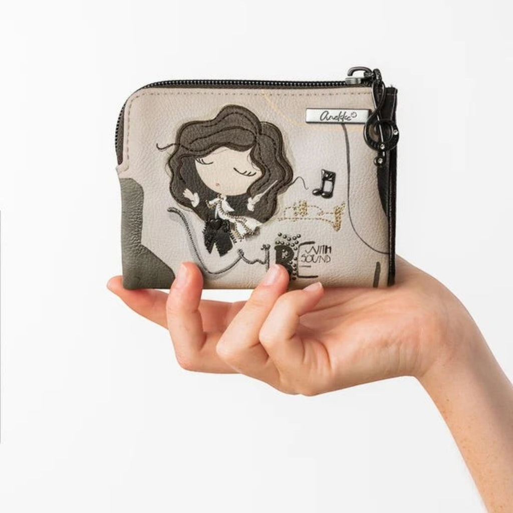 Lieblingstasche Anekke wallet in beige and grey featuring a whimsical girl illustration and musical note accents