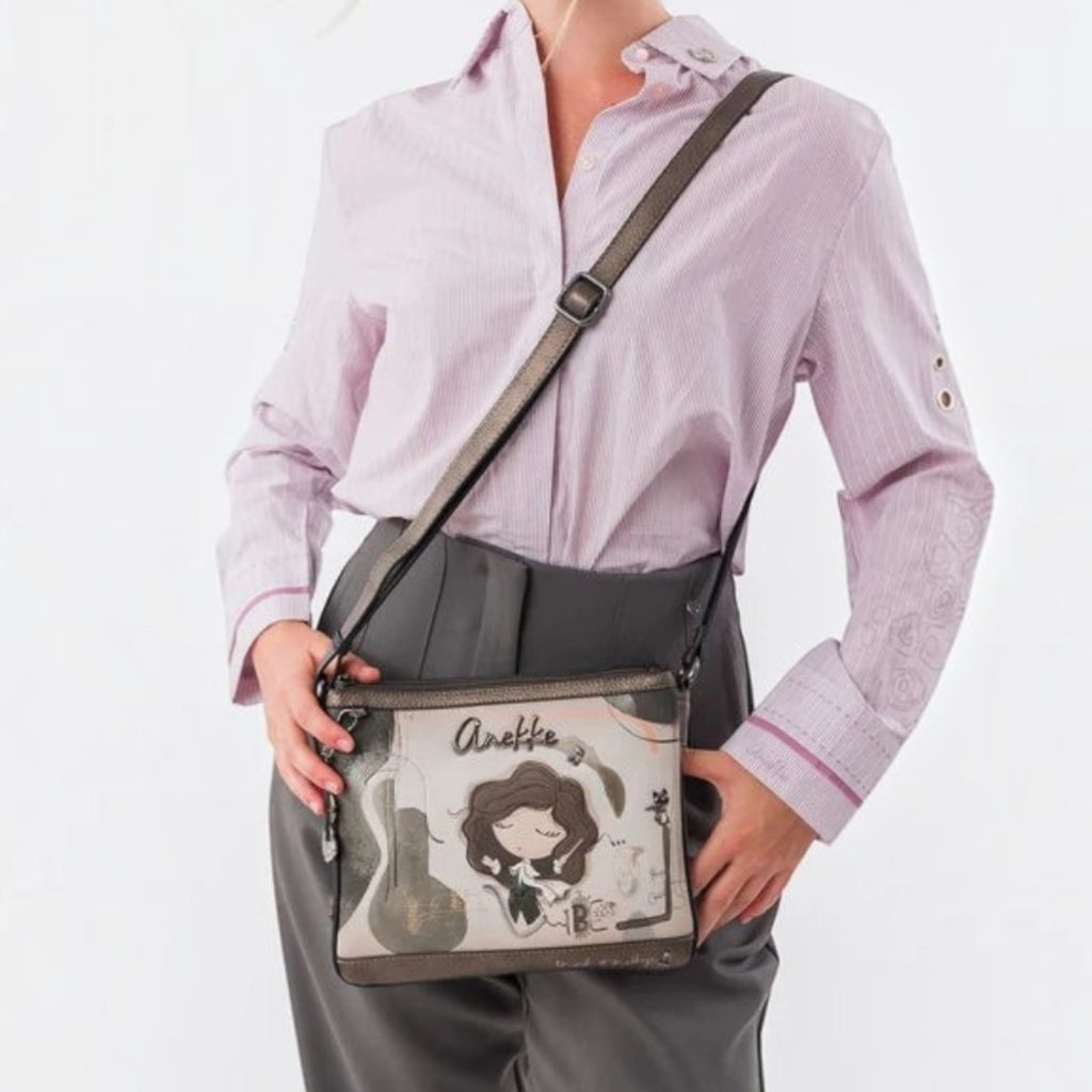 Lieblingstasche cross-body bag with Anekke illustration, featuring grey tones and an adjustable shoulder strap.