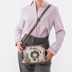 Lieblingstasche cross-body bag with Anekke illustration, featuring grey tones and an adjustable shoulder strap.
