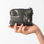 Lieblingstasche Anekke wallet in grey with textured patchwork design, metallic logo, and music note zipper pull