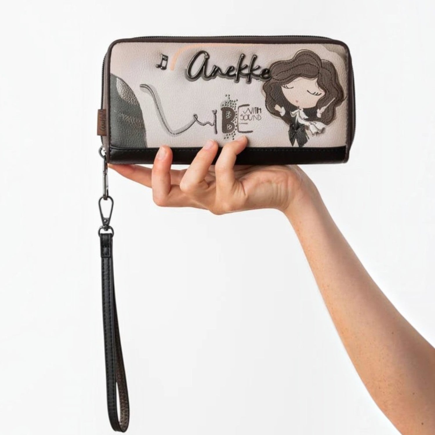 Lieblingstasche Anekke wallet featuring a whimsical girl illustration, musical notes, and a detachable wrist strap.
