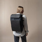 Lieblingstasche Bali Pro black backpack with faux leather accents worn by a woman.
