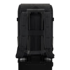 Lieblingstasche Bali Pro black backpack with padded straps and trolley sleeve, attached to a black suitcase.