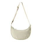 Lieblingstasche beige crescent-shaped sling bag with an adjustable strap and minimalist design