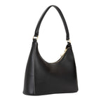 Lieblingstasche Aury Re black leather hobo bag with a curved top handle and gold-tone zipper.