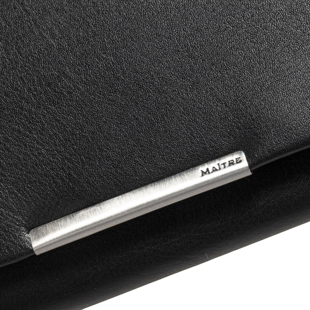 Lieblingstasche black leather purse with silver metal accent and embossed logo.