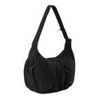 Lieblingstasche black slouchy nylon hobo bag with an adjustable shoulder strap and side pockets