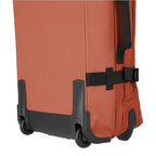 Lieblingstasche BOLONIA M rolling travel bag in burnt orange fabric with black wheels and straps.
