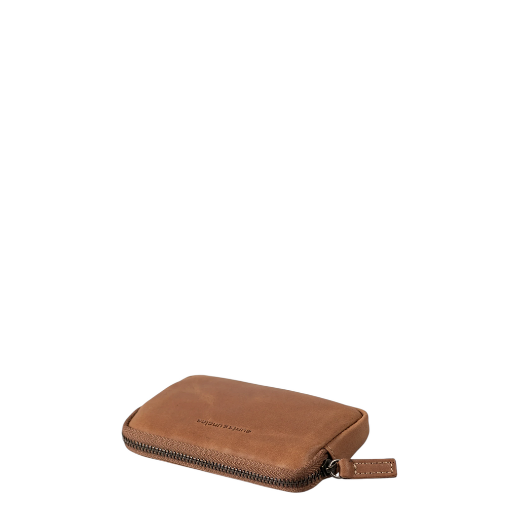 Lieblingstasche Brice brown leather wallet with a zip-around closure and embossed logo on a white background