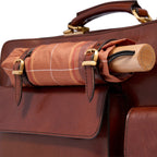 Lieblingstasche brown leather briefcase with plaid umbrella attached. Features brass buckles and stitching.