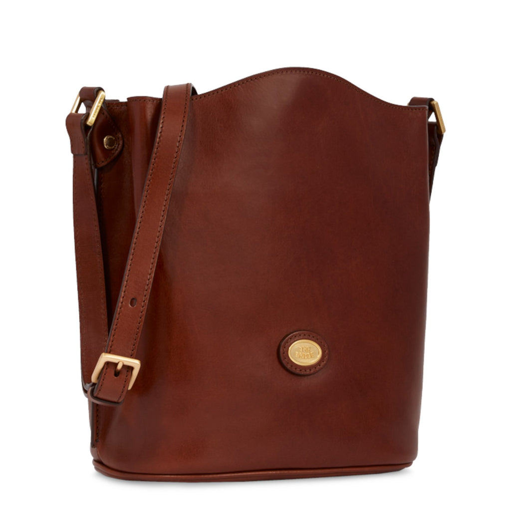 Lieblingstasche brown leather bucket bag with adjustable strap and gold buckle detail.