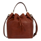 Lieblingstasche brown leather drawstring bucket bag with shoulder strap and top handle.
