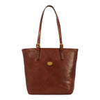 Lieblingstasche brown leather tote bag with gold buckle details and a central embossed logo.