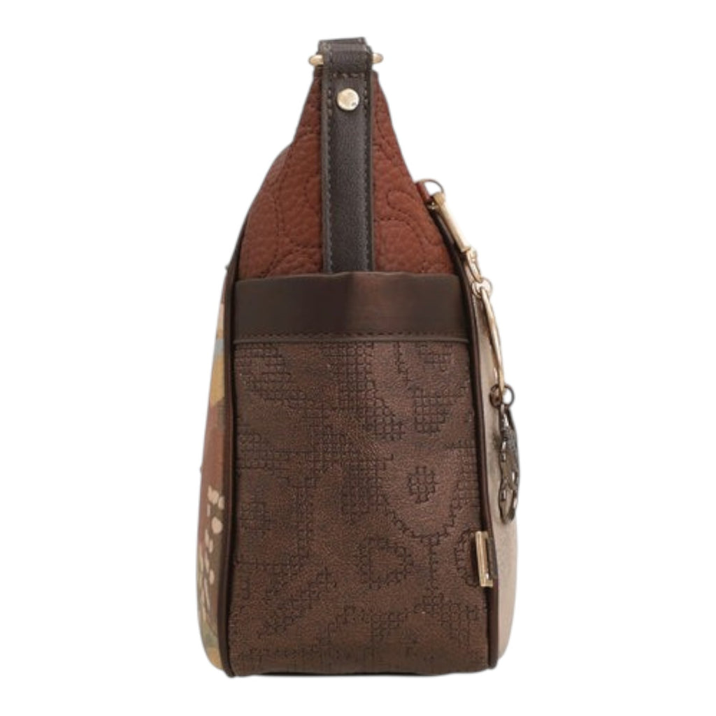 Lieblingstasche cross-body bag in brown with quilted texture, patterned side panels, and metallic hardware details.