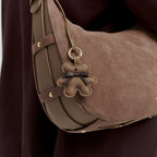 Lieblingstasche Teddy Charm brown suede and leather hobo bag with a cute bear-shaped pendant and gold hardware