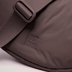 Lieblingstasche Cloud Moon Bag Small in mauve with a matching adjustable strap and embossed logo detail.