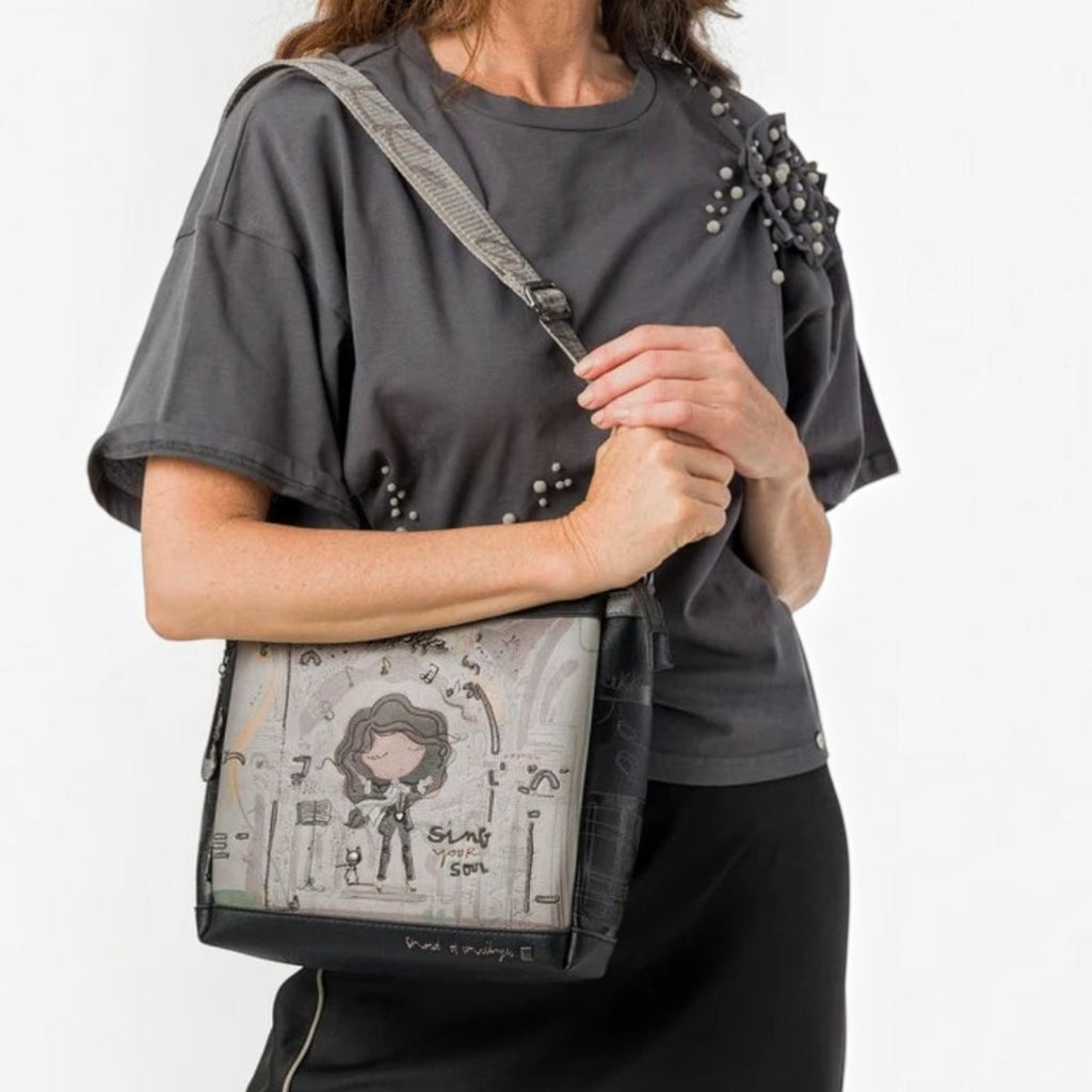 Lieblingstasche cross-body bag featuring a whimsical Sing Your Soul illustration on a grey and black synthetic material
