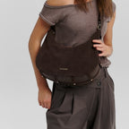 Lieblingstasche Lifetime Sister Suede M dark brown suede shoulder bag worn by a woman in a casual outfit