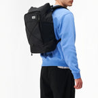 Lieblingstasche Day Pack FLX black 21L laptop backpack worn by a man in a blue sweatshirt