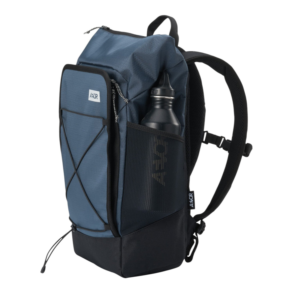 Lieblingstasche Day Pack FLX in blue with black accents, featuring a side mesh pocket and front bungee cord system.