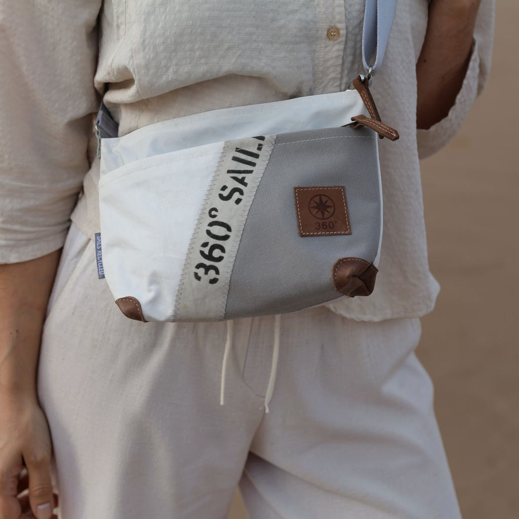Lieblingstasche Deern Lütt crossbody bag made from recycled white and grey sailcloth with brown leather accents