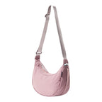 Lieblingstasche dusty pink crescent-shaped nylon sling bag with an adjustable shoulder strap