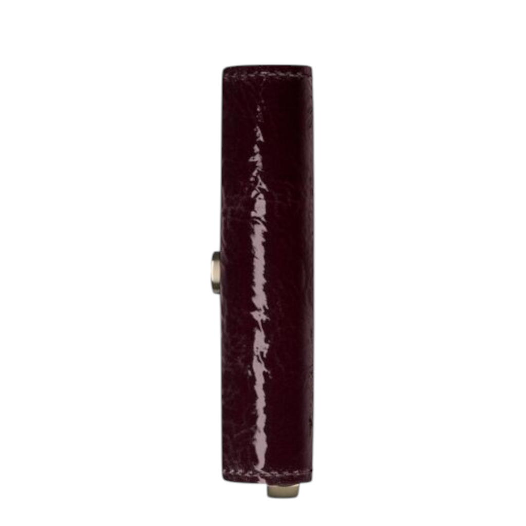 Side view of a Lieblingstasche Envelope Premium Naplak wallet in glossy dark burgundy patent leather