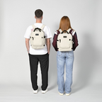 Lieblingstasche eoto Small16 beige daypack worn by a man and woman, showing compact design and black accents