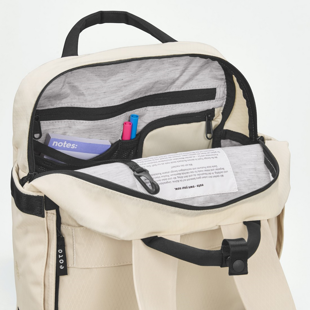 Lieblingstasche eoto Small16 beige daypack with open main compartment showing interior organizer pockets and laptop sleeve