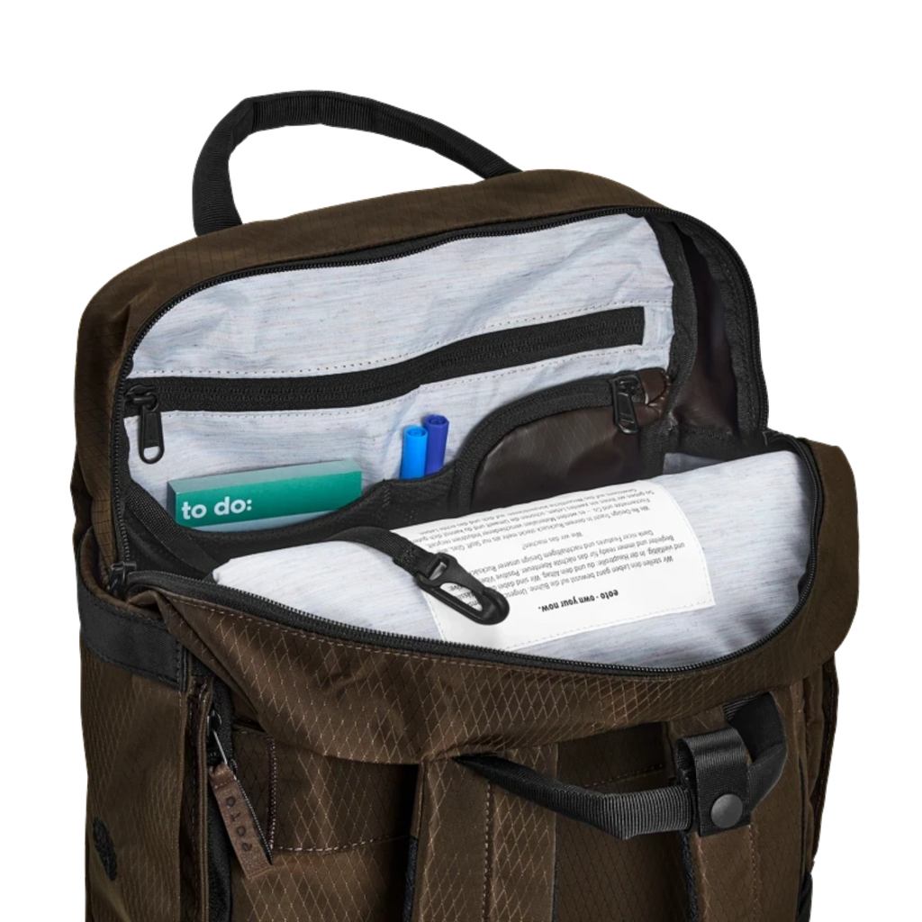 Lieblingstasche eoto Small16 brown daypack with open main compartment showing internal organizer pockets and laptop sleeve