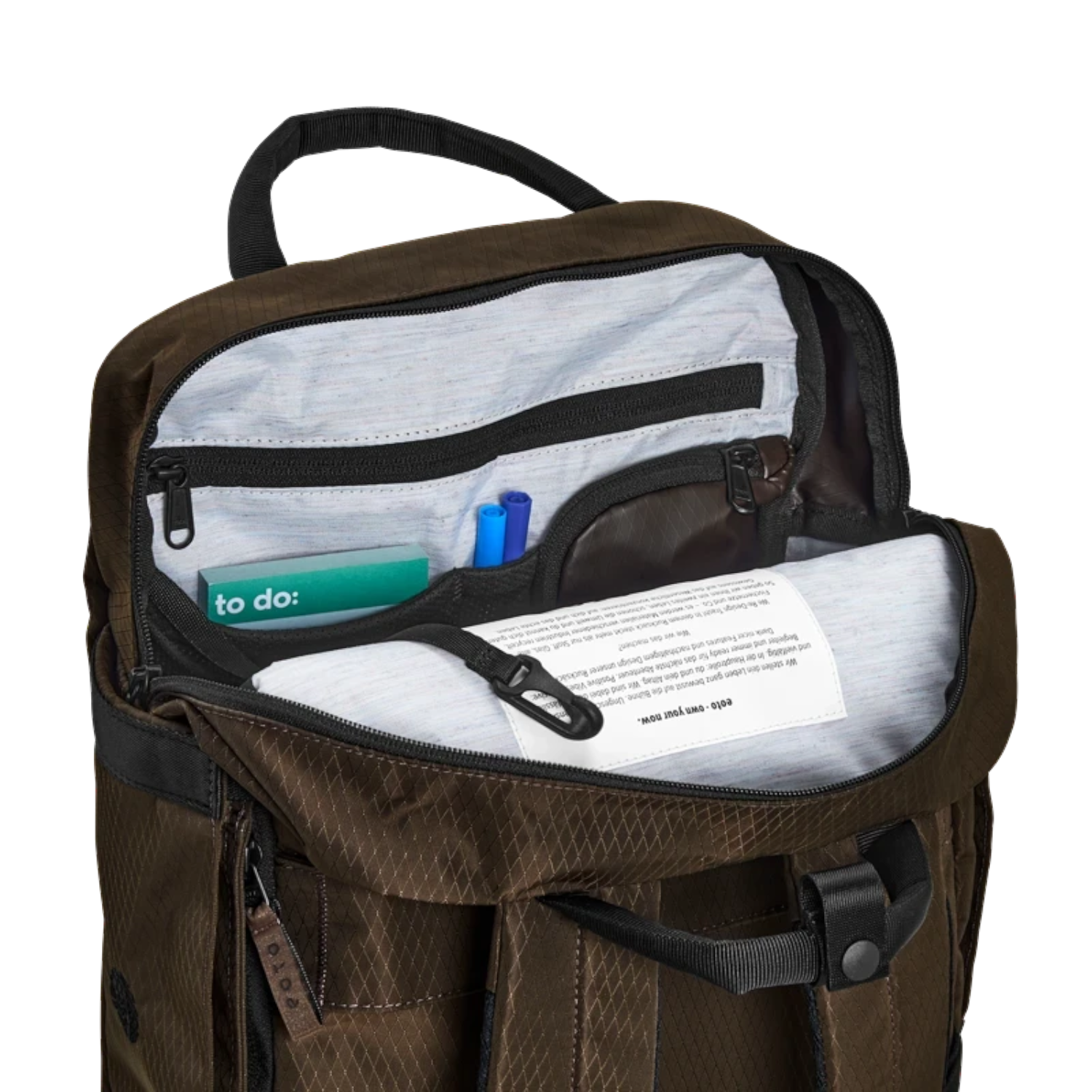 Lieblingstasche eoto Small16 brown daypack with open main compartment showing internal organizer pockets and laptop sleeve