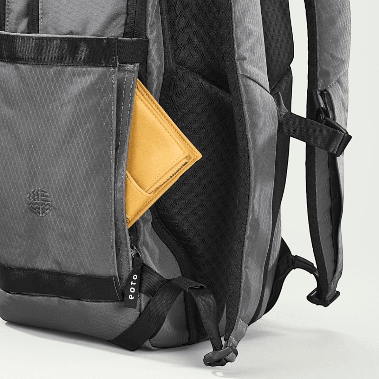 Lieblingstasche eoto Tall41 grey travel backpack with yellow wallet in side pocket and breathable back padding