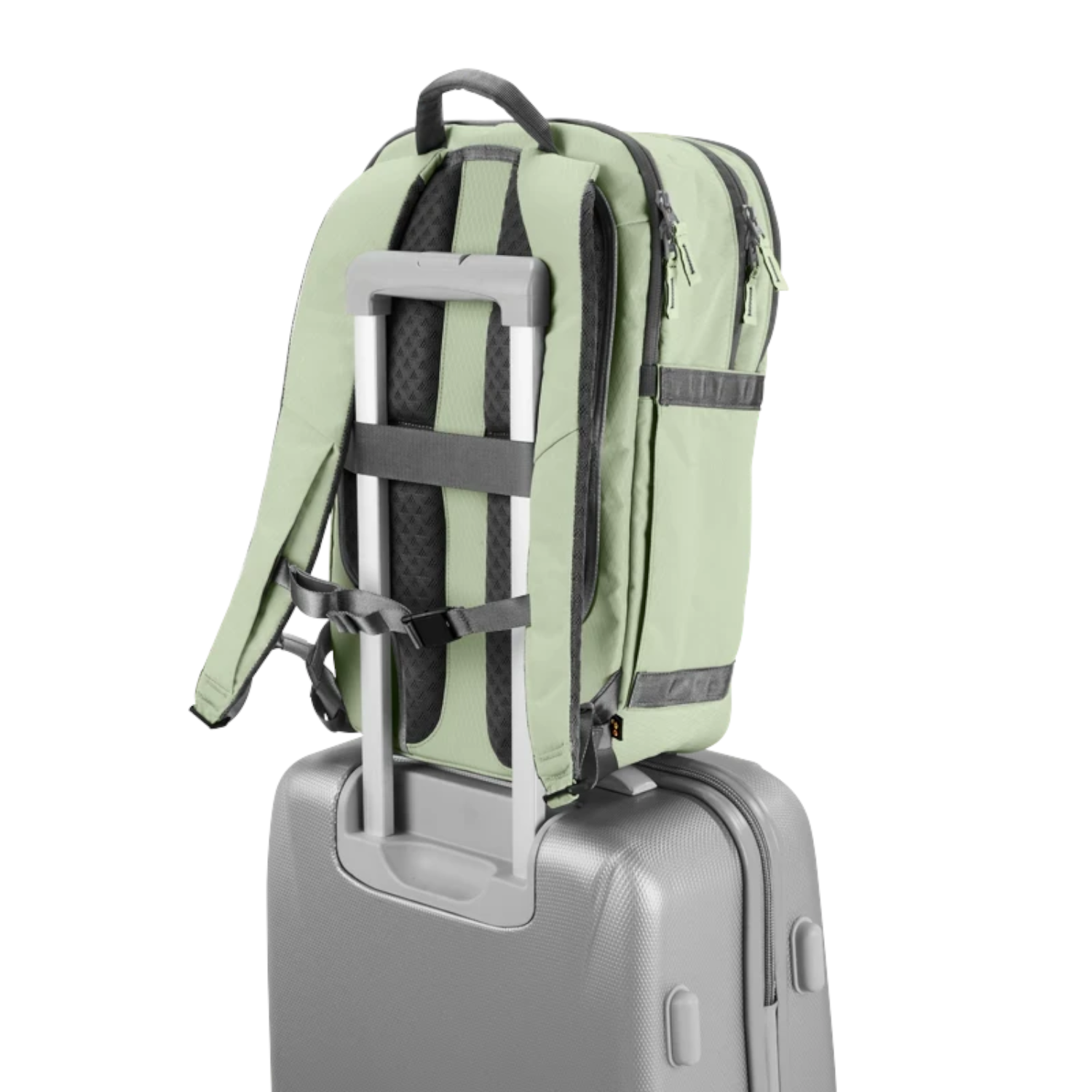 Lieblingstasche eoto Tidy22 sage green business backpack attached to a grey rolling suitcase handle