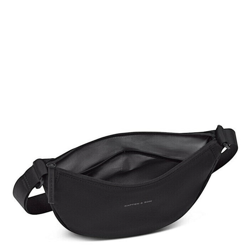Lieblingstasche Essential Moon Bag in black with a curved silhouette, zipper closure, and adjustable strap.