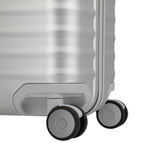 Lieblingstasche Eternity S23 silver aluminium trolley suitcase with four spinner wheels and textured surface.