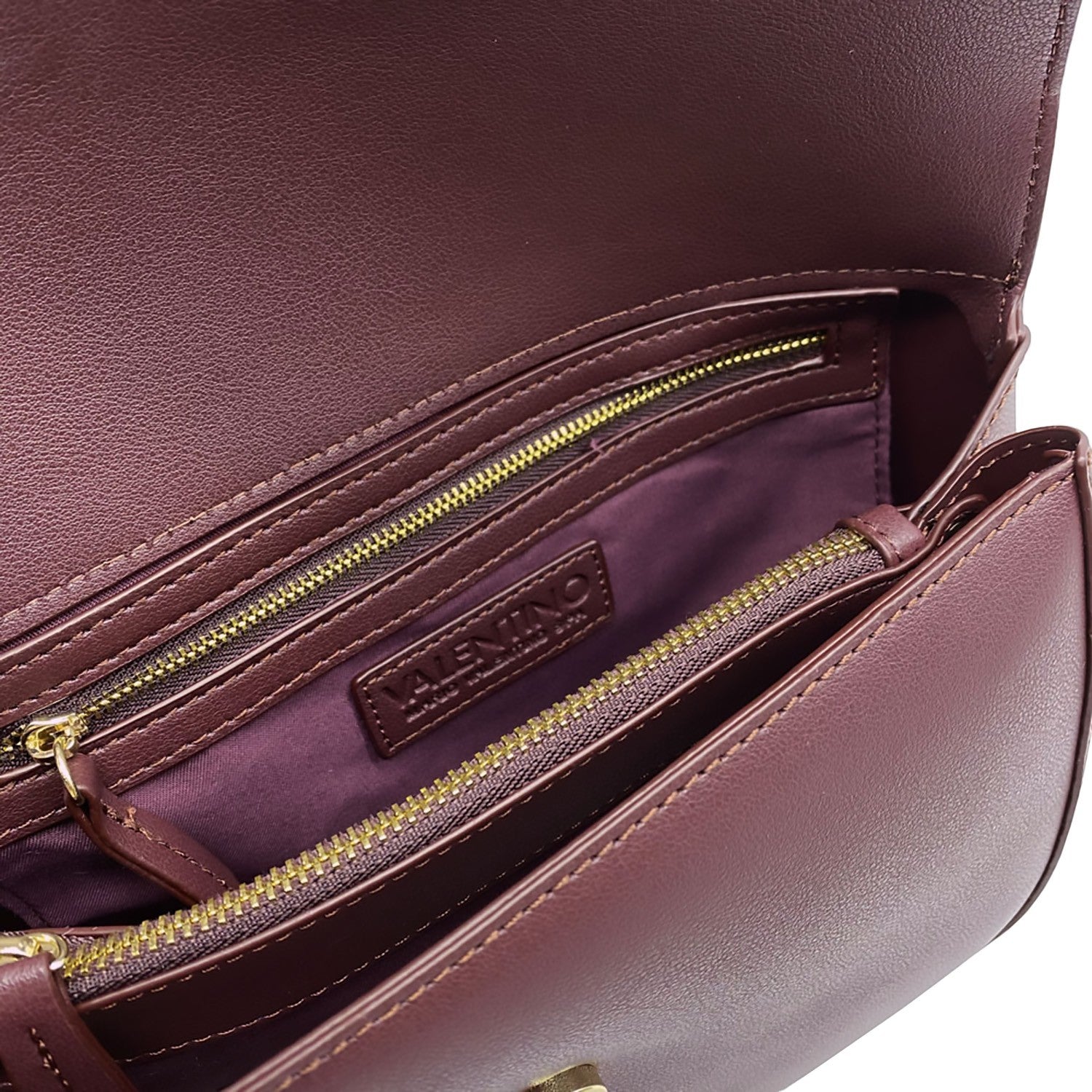 Lieblingstasche Flap Bag Bigs in deep burgundy leather with gold-tone zippers and interior logo.