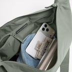 Lieblingstasche GOT BAG Moon Bag Large in sage green with interior pockets and personal items inside