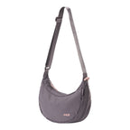Lieblingstasche grey crescent-shaped sling bag with adjustable shoulder strap and pink zipper details