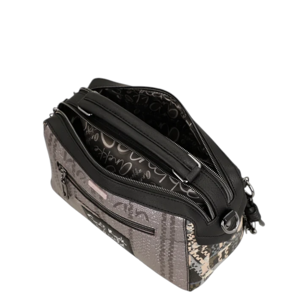 Lieblingstasche cross-body bag featuring a grey patterned exterior with black trim and a printed interior lining