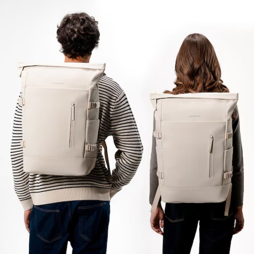 Lieblingstasche Helsinki Pro beige rolltop backpack worn by a man and woman against a white background