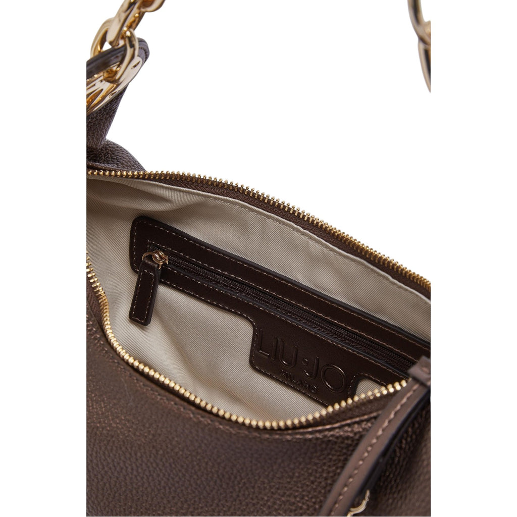 Lieblingstasche ECS Hobo S bag interior featuring a zippered pocket, beige lining, and gold-tone hardware details.