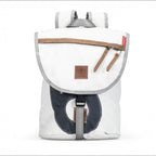 Lieblingstasche Landgang Mini backpack in white recycled sailcloth with navy blue accents and brown leather trim.