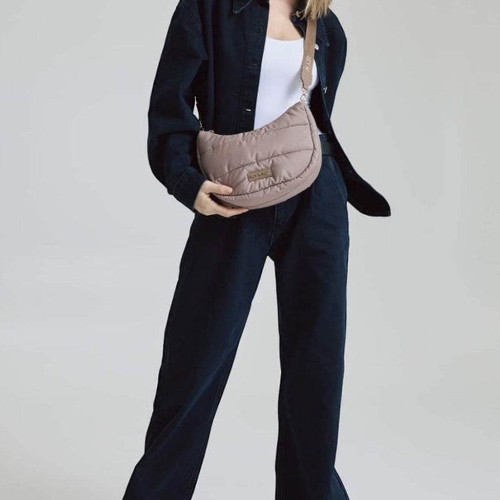 Lieblingstasche Lifetime Buddy S quilted taupe crossbody bag worn by a model in dark denim outfit