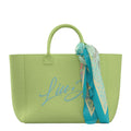 Lieblingstasche Tote L in lime green canvas with blue script embroidery and a decorative patterned silk scarf