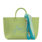 Lieblingstasche Tote L in lime green canvas with blue script embroidery and a decorative patterned silk scarf